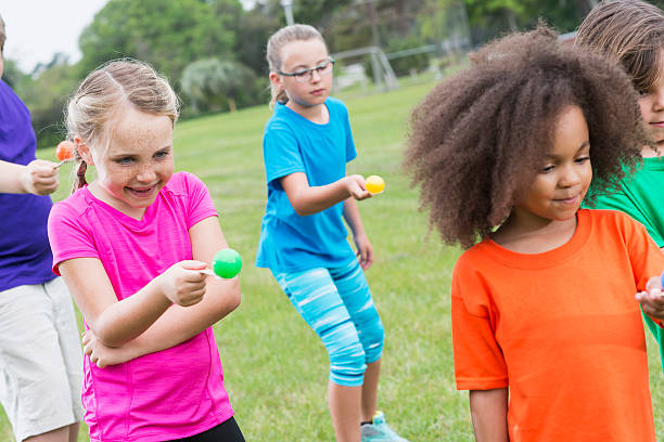 istock Group of children in egg spoon race 486883492
