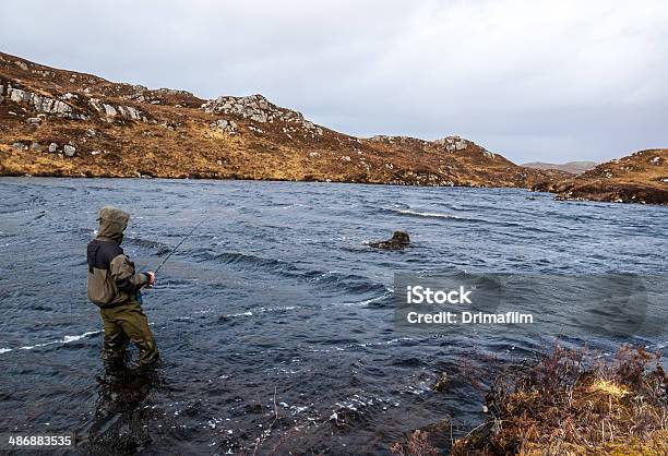 Man Fishing For Trout And Salmon In A Scottish Loch Stock Photo - Download Image Now