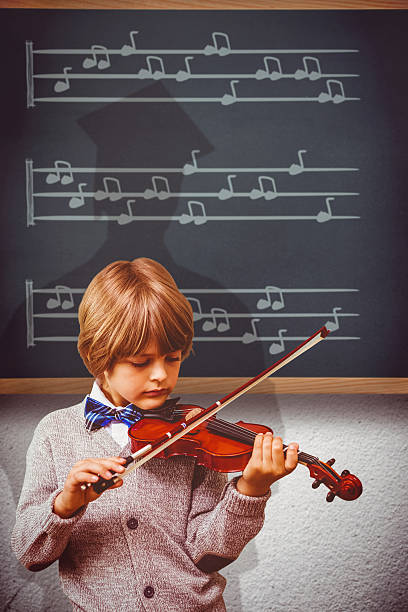 istock Composite image of cute little boy playing violin 486886934