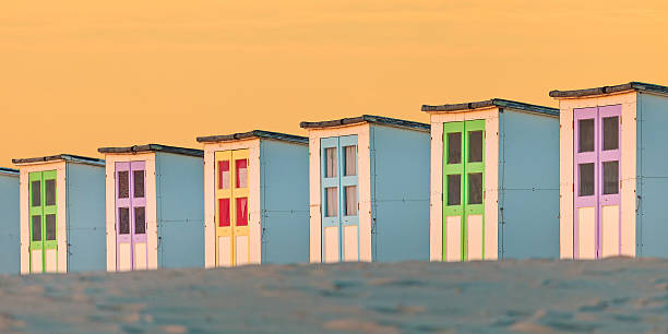 istock Row of old wooden beach cabins during sunset 486888466