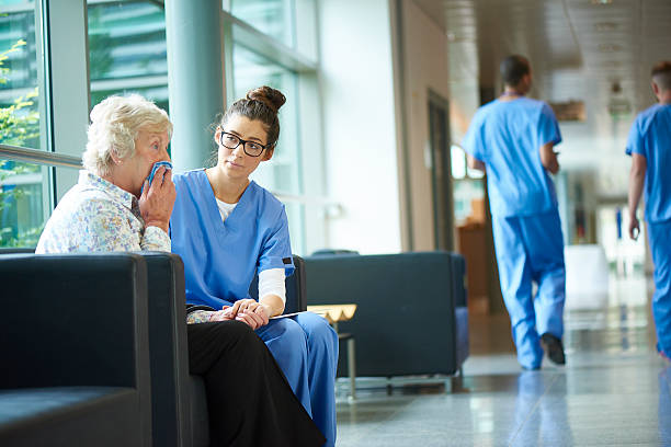 istock consoling a worried relative in the hospital 486888842