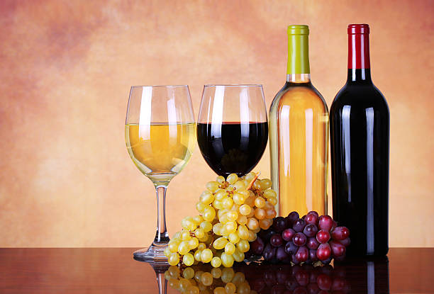 istock Bottles of Red and White Wine with Fresh Grapes. 486894483