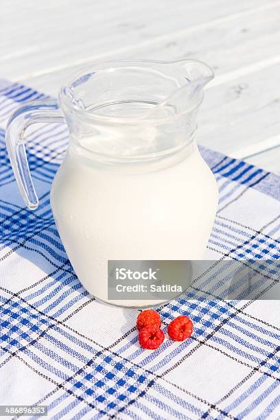 Milk In Jug And Red Raspberry Stock Photo - Download Image Now - Agriculture, Berry Fruit, Breakfast