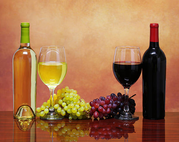 istock Bottles of Red and White Wine with Fresh Grapes 486896485