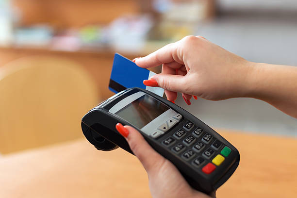 istock Woman pay by credit card 486896619