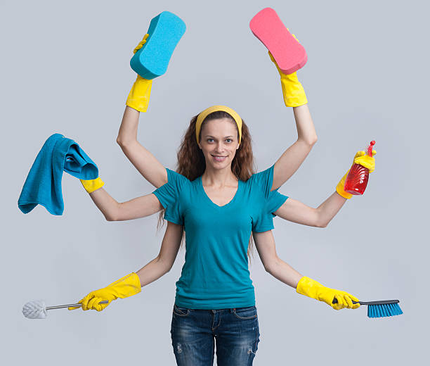 istock woman in a domestic role multitasking her cleaning 486896686