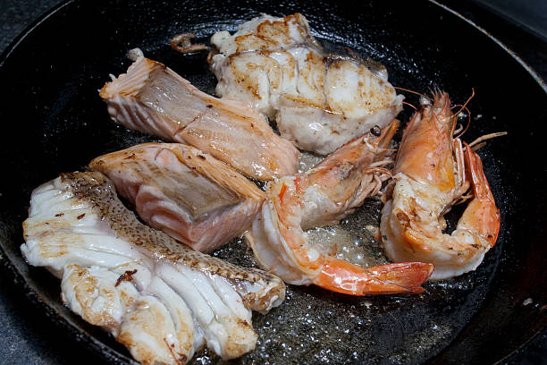 istock fried seafood on frying pan 486896778