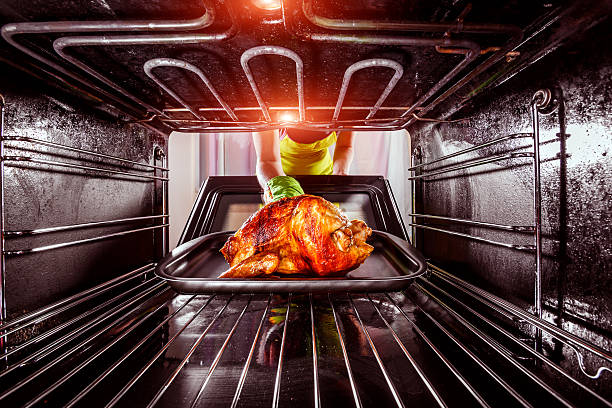 istock Cooking chicken in the oven at home. 486897124