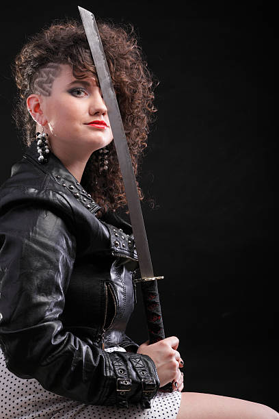 istock piercing woman curly girl and sword 486897931
