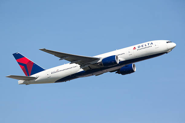 Delta Airlines Boeing 777-200LR Frankfurt, Germany - June 3, 2010: Delta Airlines Boeing 777-200LR taking off from the Frankfurt International Airport. hesse germany photos stock pictures, royalty-free photos & images