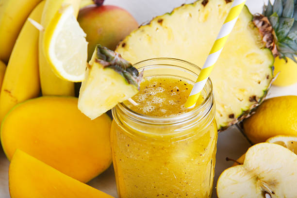 istock Fresh organic yellow smoothie with banana, apple, mango, pear, p 486900297