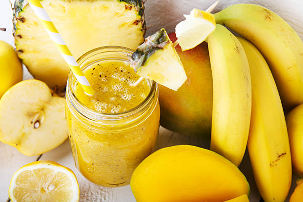 istock Fresh organic yellow smoothie with banana, apple, mango, pear, p 486900301