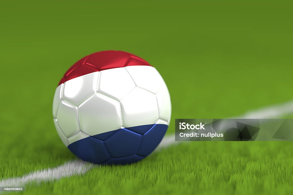 soccer ball with dutch flag a soccer ball with flag of the netherlands on green grass.  Color Image Stock Photo