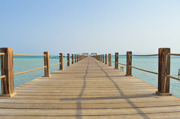istock Wooden jetty on a tropical island beach 486901350