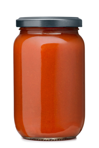 Tomato sauce jar on white background