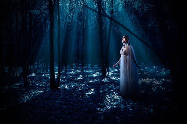 istock Elven girl at night forest 486901798