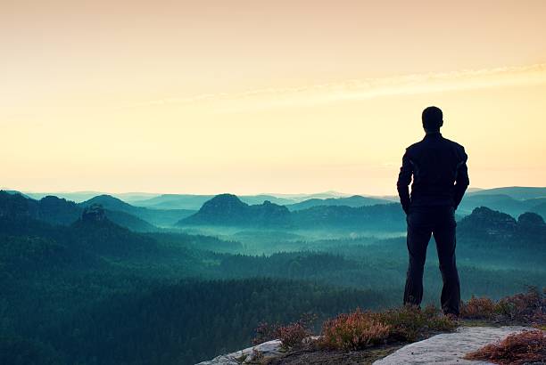istock Man gesture hands on hips. Satisfy hiker in dark sportswear 486902932