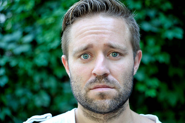 istock Portrait of a sad young man 486906720