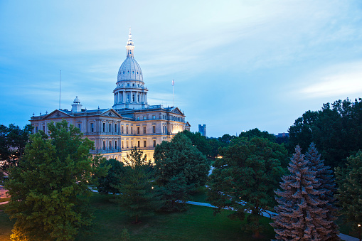 Aerial shot of the Michigan State Capitol Building in Lansing in pre-dawn twilight on a Fall morning. \n\nAuthorization was obtained from the FAA for this operation in restricted airspace.