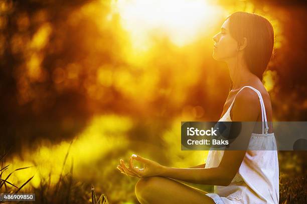 Yoga Woman Meditating At Sunset Stock Photo - Download Image Now - 2015, Activity, Adult