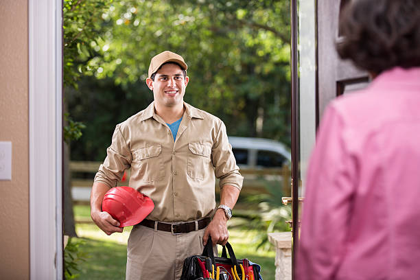 istock Service Industry: Latin descent repairman at customer's front door. 486912208