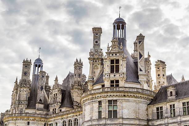 Chambord, France - August 18, 2015: Panoramic  view of Chambord Castle from the river. Built as a hunting lodge for King Francois I, between 1519 and 1539, this castle is the largest and most frequented of the Loire Valley.