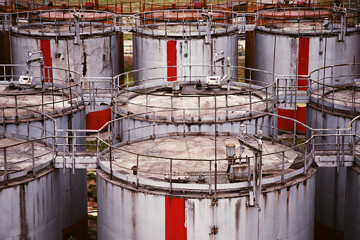 pattern of old large oil storage tanks. Retro style image