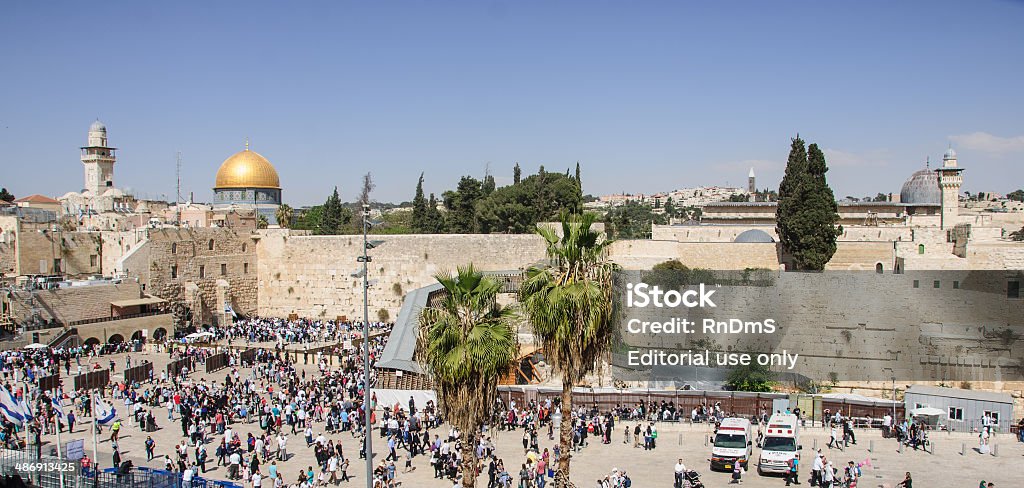 The Western Wall Jerusalem, Israel - April 17, 2014: The Western Wall crowded with Passover prayers, and the Dome of the Rock in the background, in the old city of Jerusalem, Israel Jerusalem Stock Photo