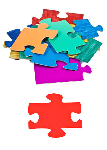 istock red piece near pile of jigsaw puzzles 486917025