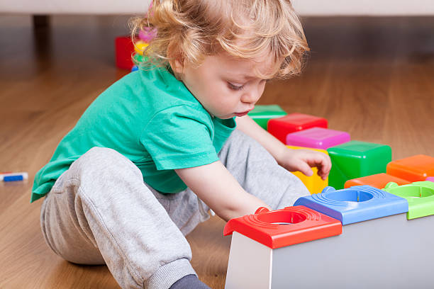 istock Toddler playing on the floor 486917267