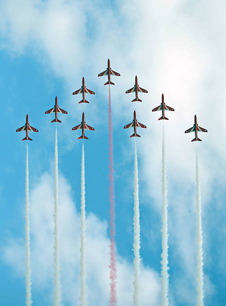 Red Arrows display Bournemouth,England - August 30, 2013: The nine BAE Hawks of the crack display team, The Red Arrows, perform a close formation manoevre at the Bournemouth Air Festival british aerospace stock pictures, royalty-free photos & images