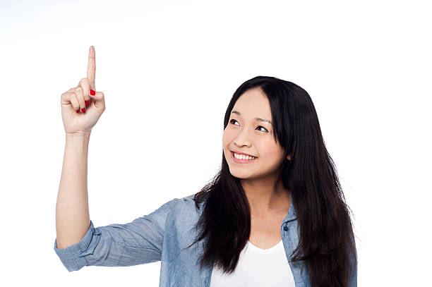 istock Pretty girl looking and pointing upwards 486917761