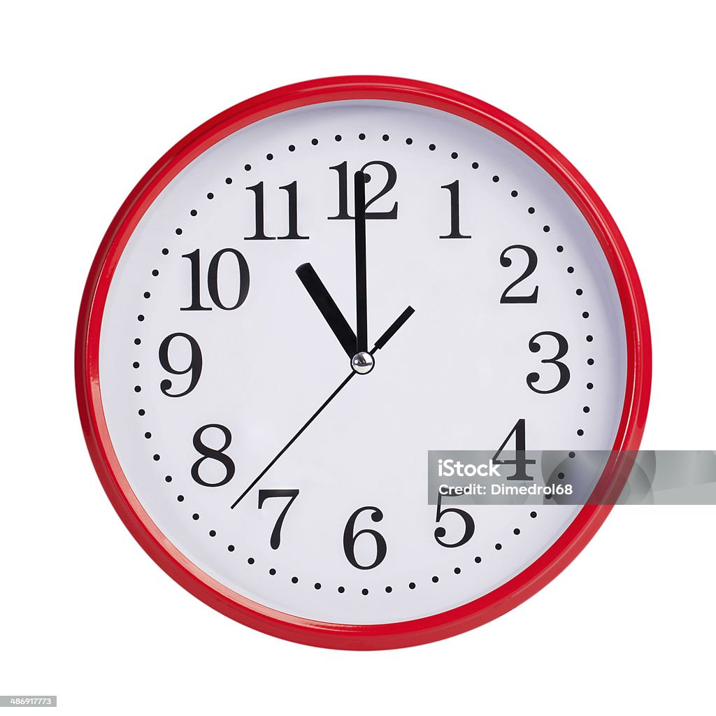 Eleven o'clock on a round dial Eleven o'clock on a red round dial Clock Stock Photo