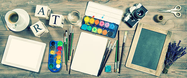 istock Artistic workplace mockup. Office supplies, digital tablet, vintage camera 486918212