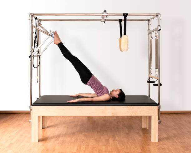 Pilates Work On Trapeze Table Stock Photo - Download Image Now - Pilates,  Pilates Machine, Sport - iStock