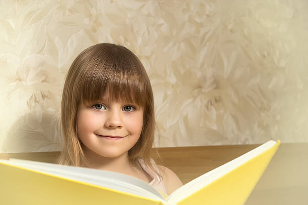 istock Smart little girl with the book 486919638