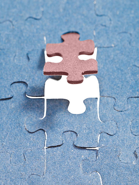 istock setting the brown last piece of puzzle 486919661