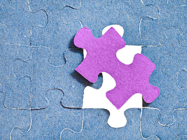 istock setting the last pink piece of puzzle 486919701