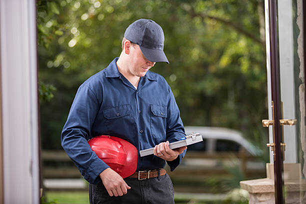 istock Service Industry: Repairman at customer's front door. 486920892