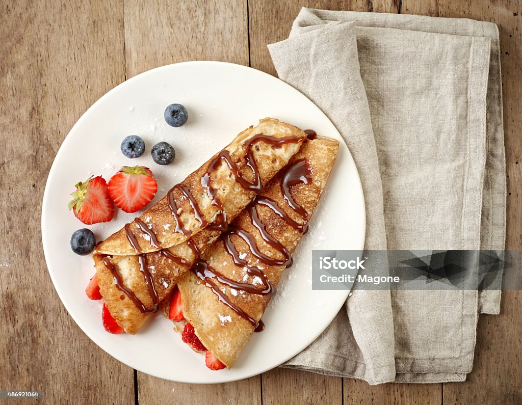 Crepes with strawberries and chocolate Crepes with strawberries and chocolate sauce Plate Stock Photo