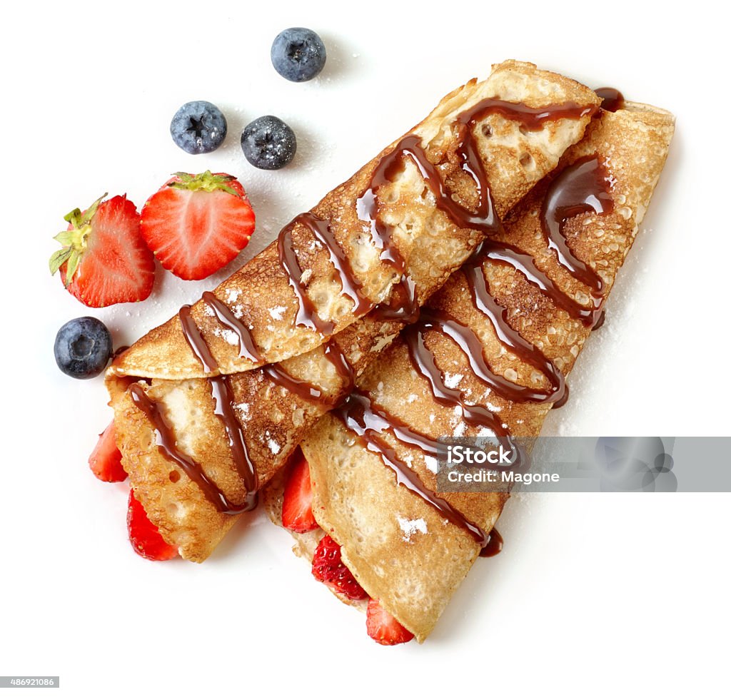 Crepes with strawberries and chocolate Crepes with strawberries and chocolate sauce isolated on white background Crêpe - Pancake Stock Photo