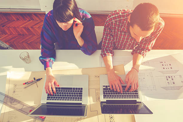 istock Young group of people/architects discussing business plans 486921118
