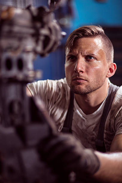 istock Young handsome car mechanic 486923458