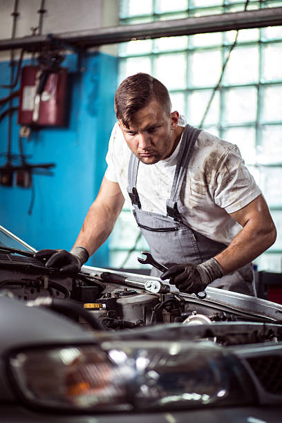 istock Car mechanic with wrench 486924662