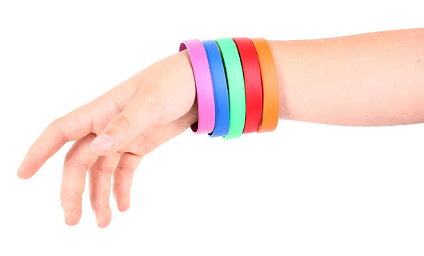 istock Hand with colorful rubber bracelets 486925498