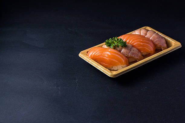 istock japanese sushi Salmon on black 486926418