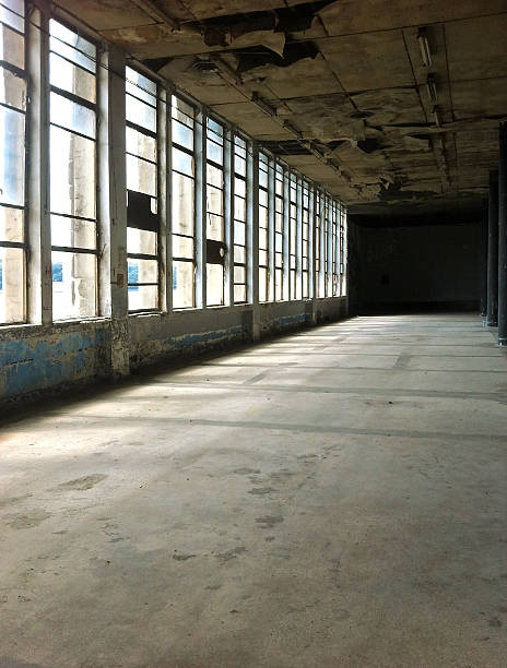 istock interior of abandoned building with light from windows 486926622