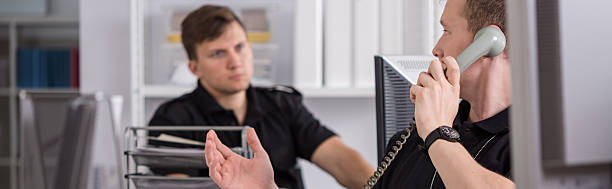 istock Policemen working in office 486930960