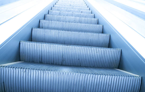 istock modern steps of moving business escalator 486932225