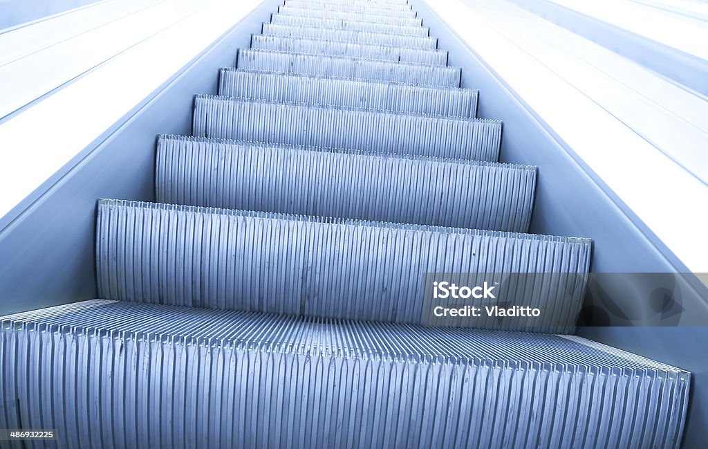 modern steps of moving business escalator Airport Stock Photo